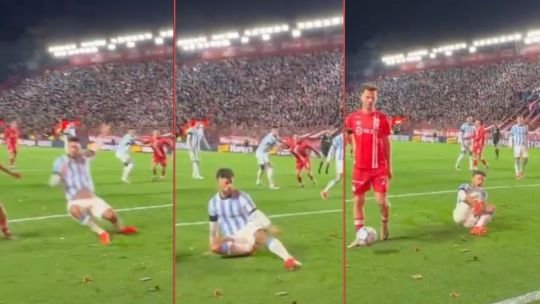 Jugador de Racing tendido en el césped tras una lesión